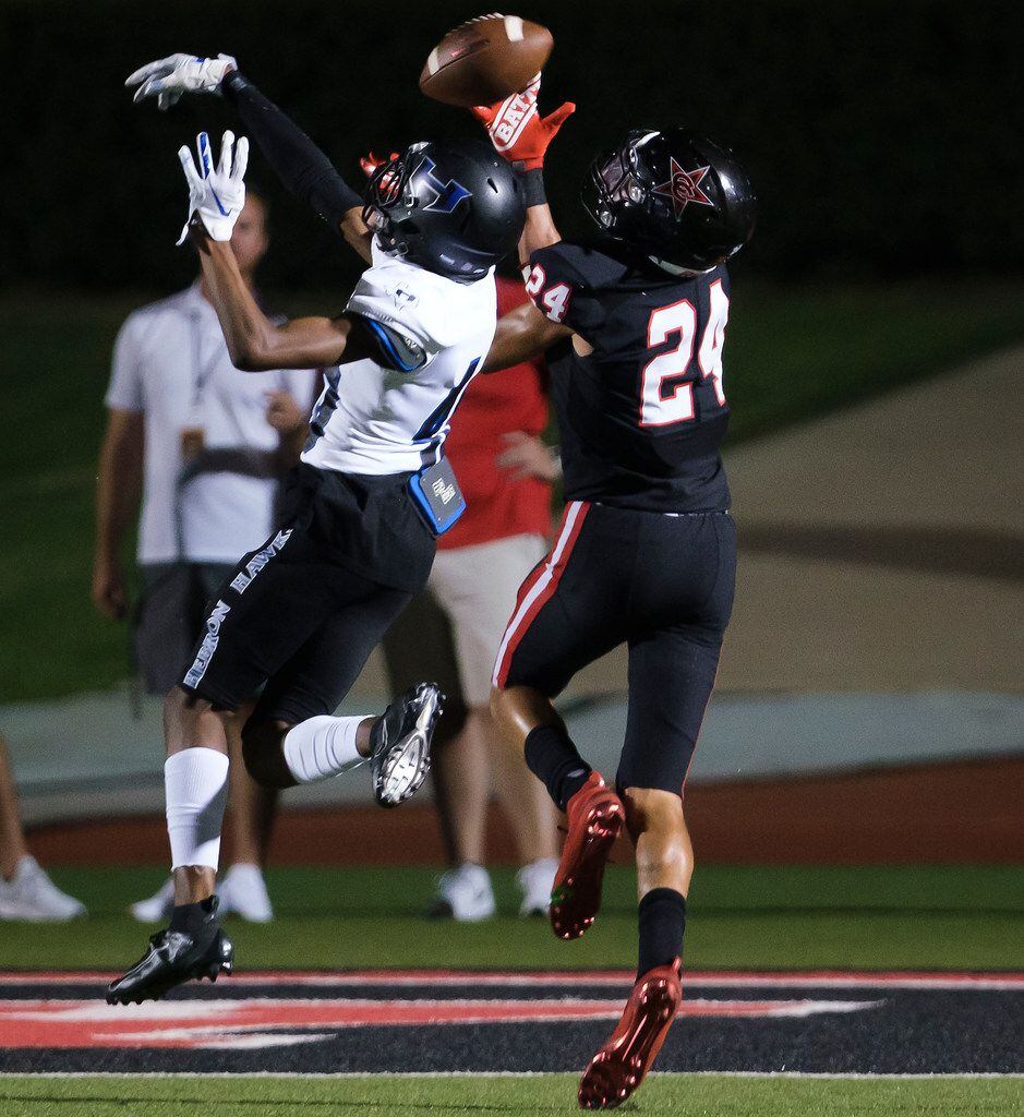Coppell wide receiver Anthony Black (24) hauls in a touchdown catch over Hebron defensive...
