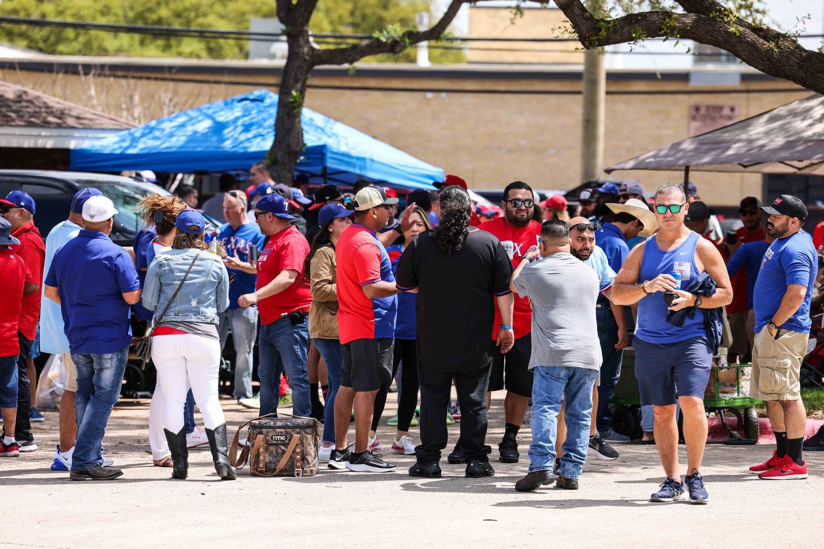 Fans gather outside the Globe Life Field before the game between Texas Rangers and Toronto Blue Jays on opening day in Arlington, Texas on Monday, April 5, 2021. (Lola Gomez/The Dallas Morning News)