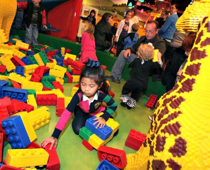 Sofia San Juan, 5, plays with life-size Legos at the Duplo Village inside the LegoLand...