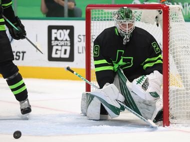 Dallas Stars goaltender Jake Oettinger (29) watches as the puck rolls in a game against the Detroit Red Wings during the second period of play at American Airlines Center on Thursday, January 28, 2021in Dallas.