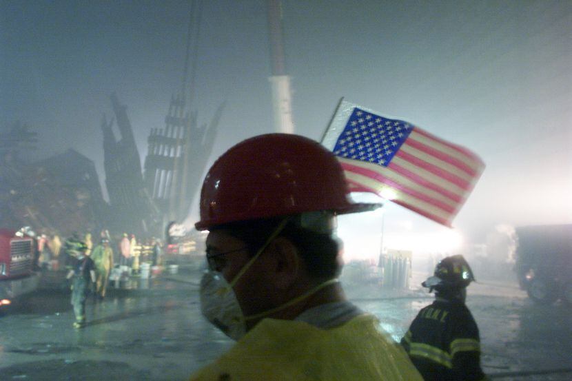 The remains of one of the World Trade Center towers provided a dreary backdrop for...
