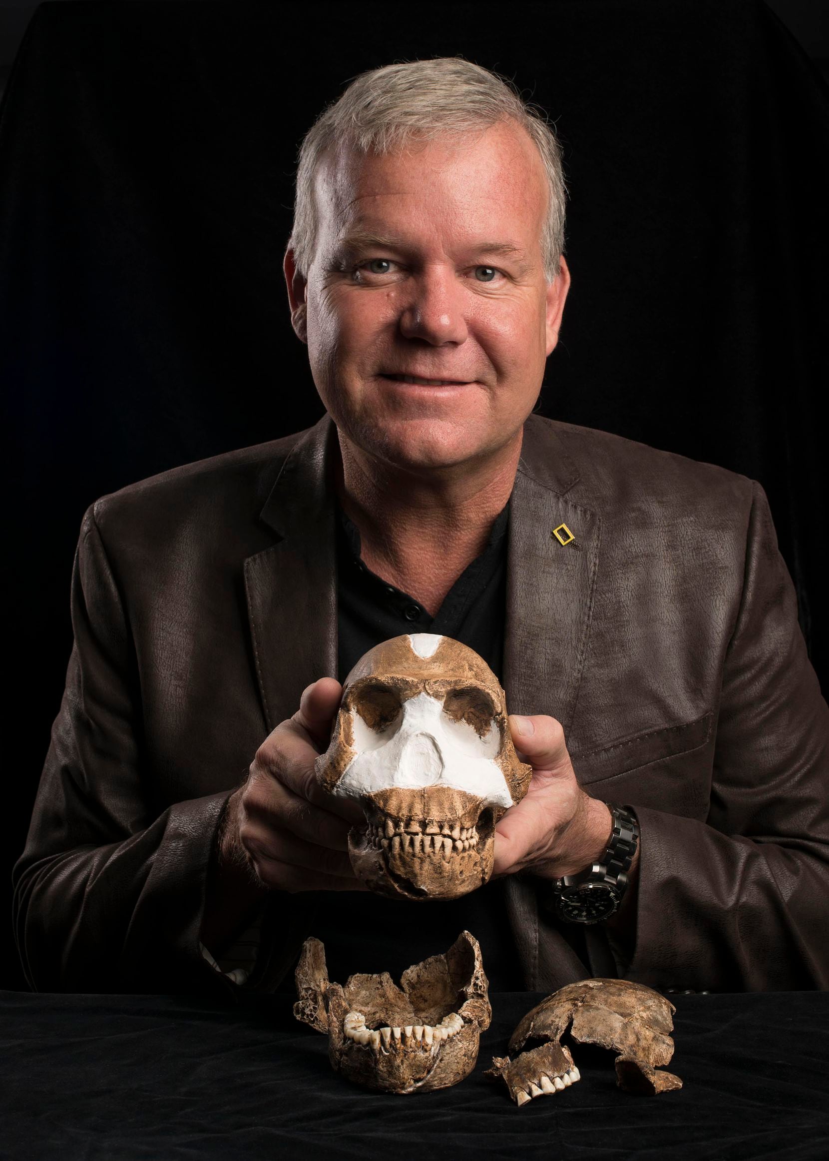 Professor Lee Berger with Homo naledi, estimated to be around 300,000 years old. 