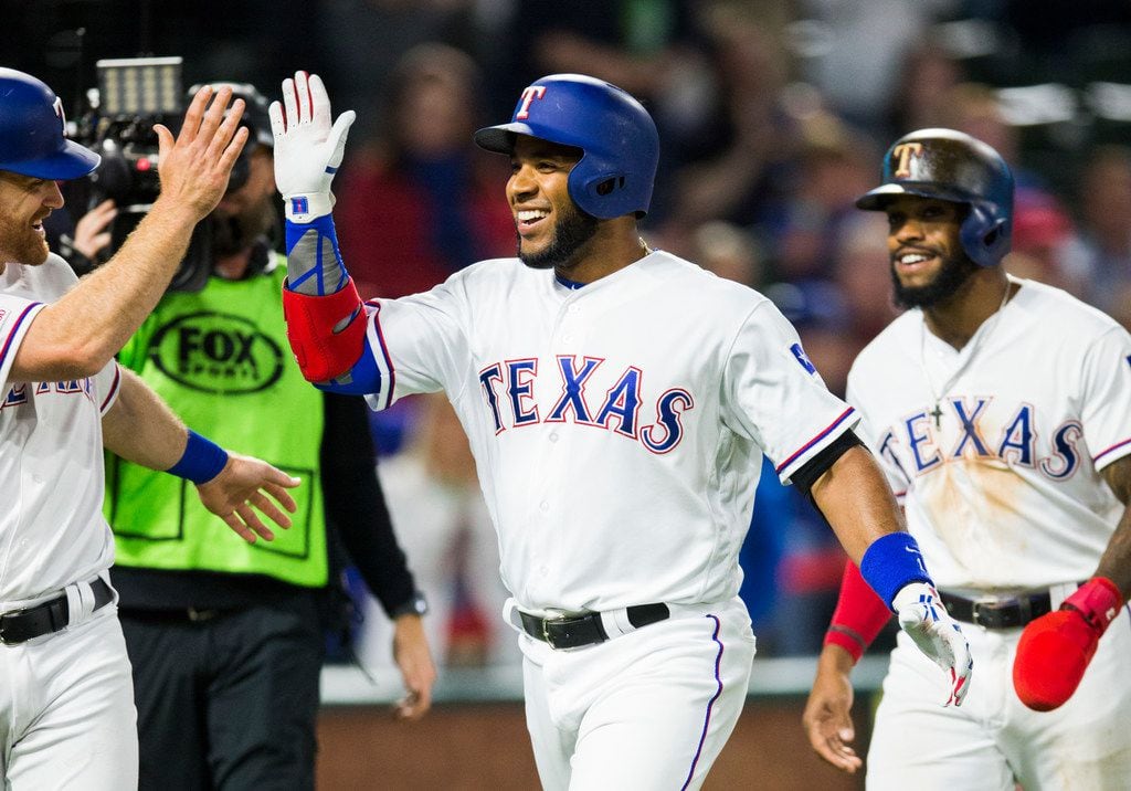 Texas Rangers shortstop Elvis Andrus (1) celebrates a home run during the fifth inning of an...