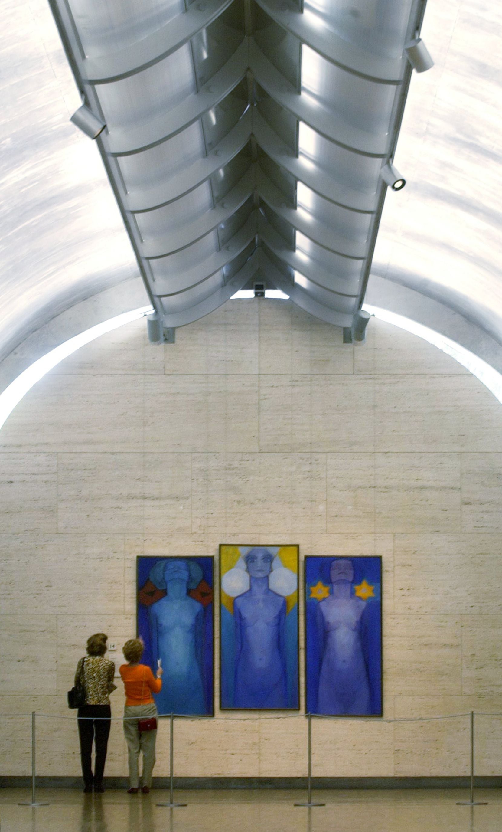 Patrons admire 'Evolution,' a painting by Mondrian, at the Kimbell Art Museum in Fort Worth...