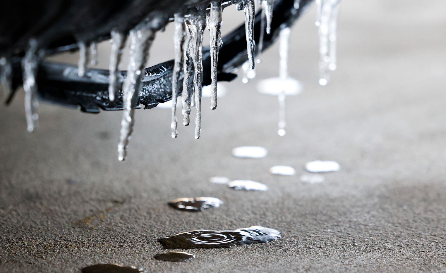 Small icicles melt off the front of a car in Dallas on Wednesday, Feb. 1, 2023. A half inch...