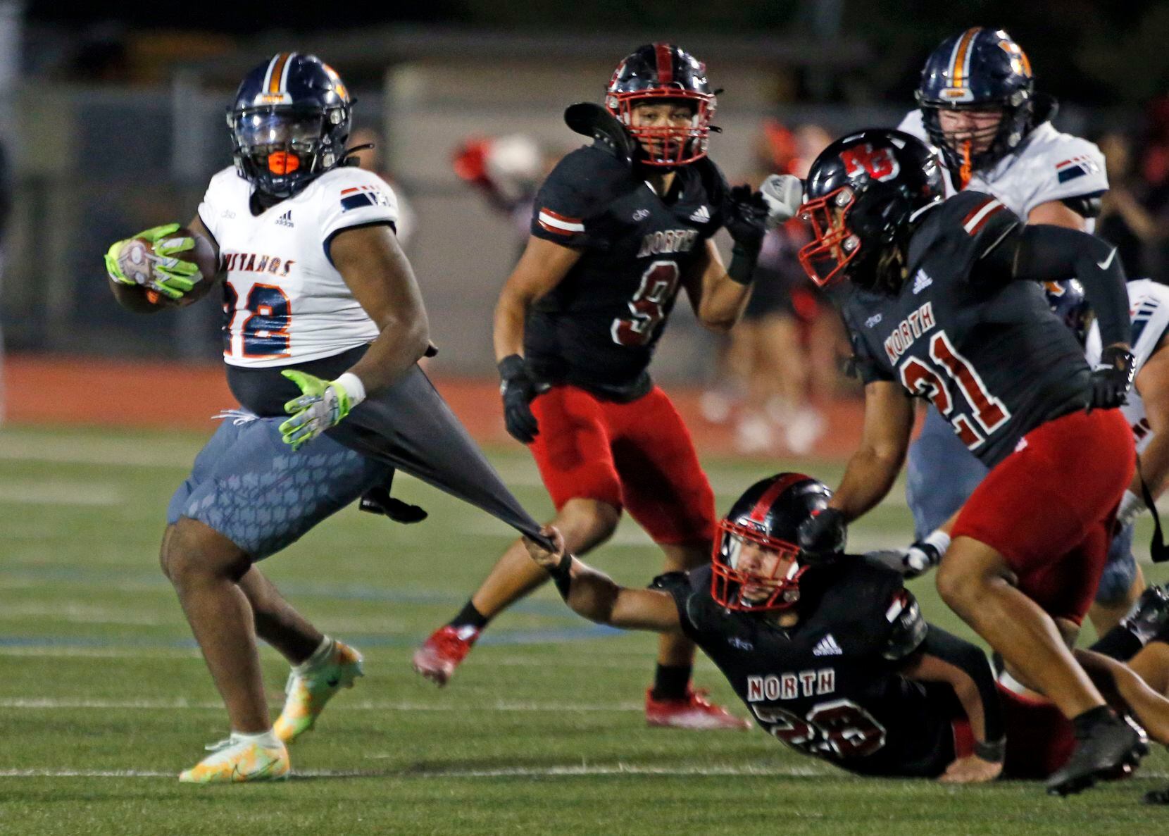 A North Garland defender tries to but can’t reel in Sachse RB Khalyse Harris (22) during the...