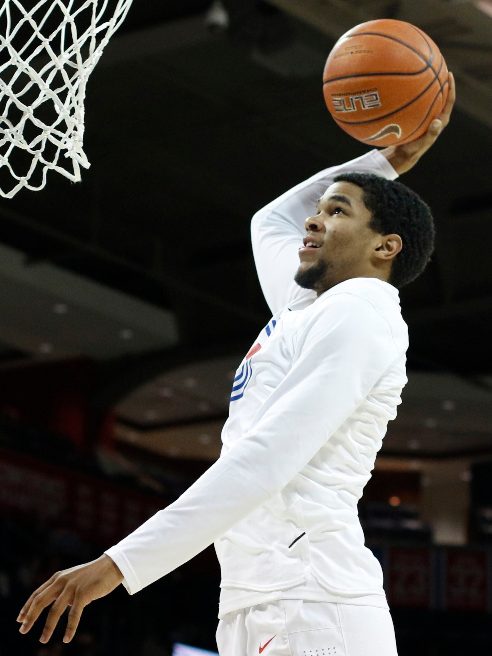 SMU guard Charles Smith (4) skies to the basket during team warm-up drills prior to the...