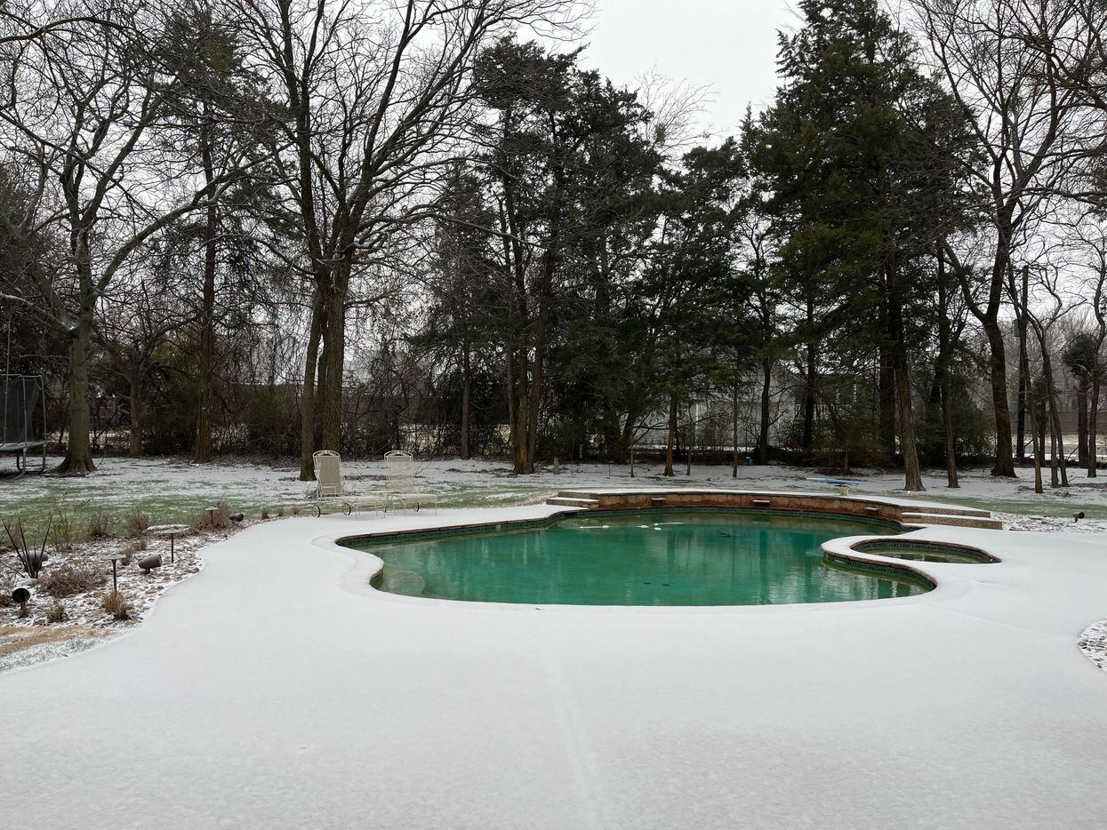 Frozen precipitation covers a backyard in Mansfield on Tuesday, Jan. 31, 2023. 