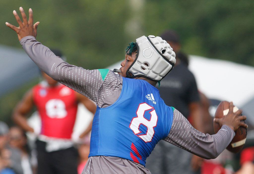 Arlington quarterback Kris Sims unleashes a long pass during the 7-on-7 state tournament in...