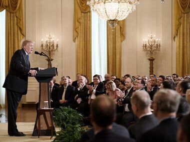 President Donald Trump addresses mayors during a working session in the East Room of the...