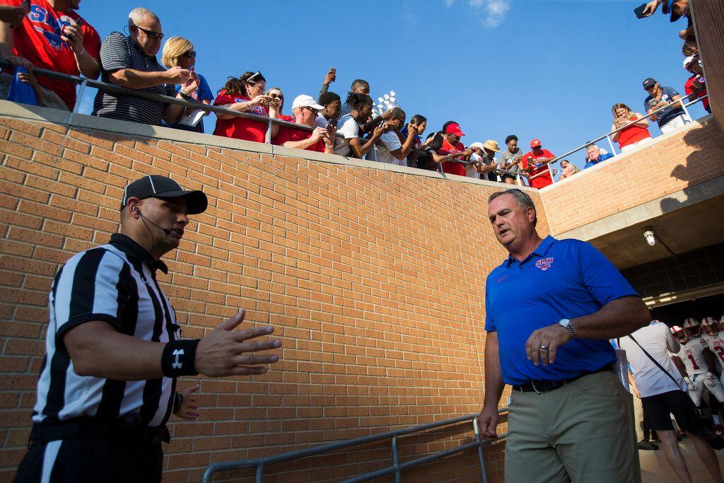 Southern Methodist Mustangs head coach Sonny Dykes makes his way to the field prior to a...