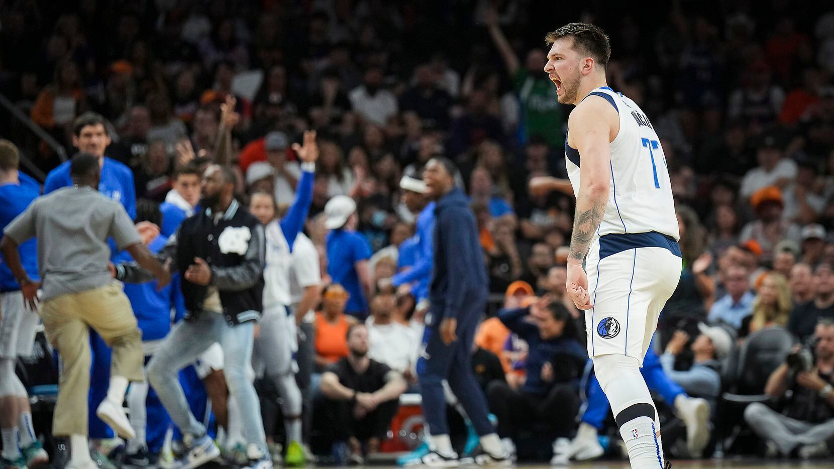 Dallas Mavericks guard Luka Doncic celebrates after hitting a 3-pointer during the second...