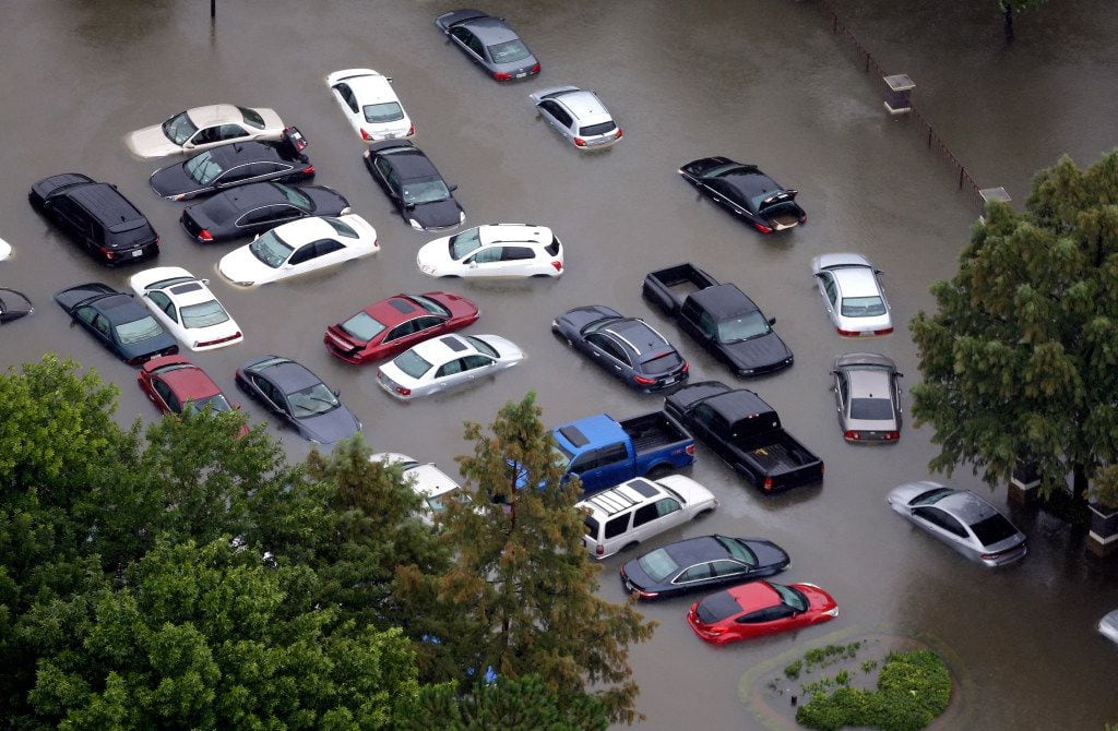 Cars near the Addicks Reservoir in Houston were flooded.