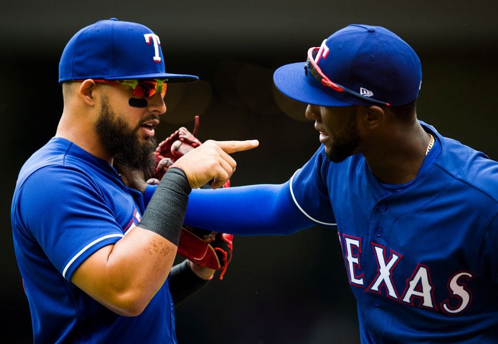 Texas Rangers second baseman Rougned Odor (12) jokes with Texas Rangers 3B Jurickson Profar...
