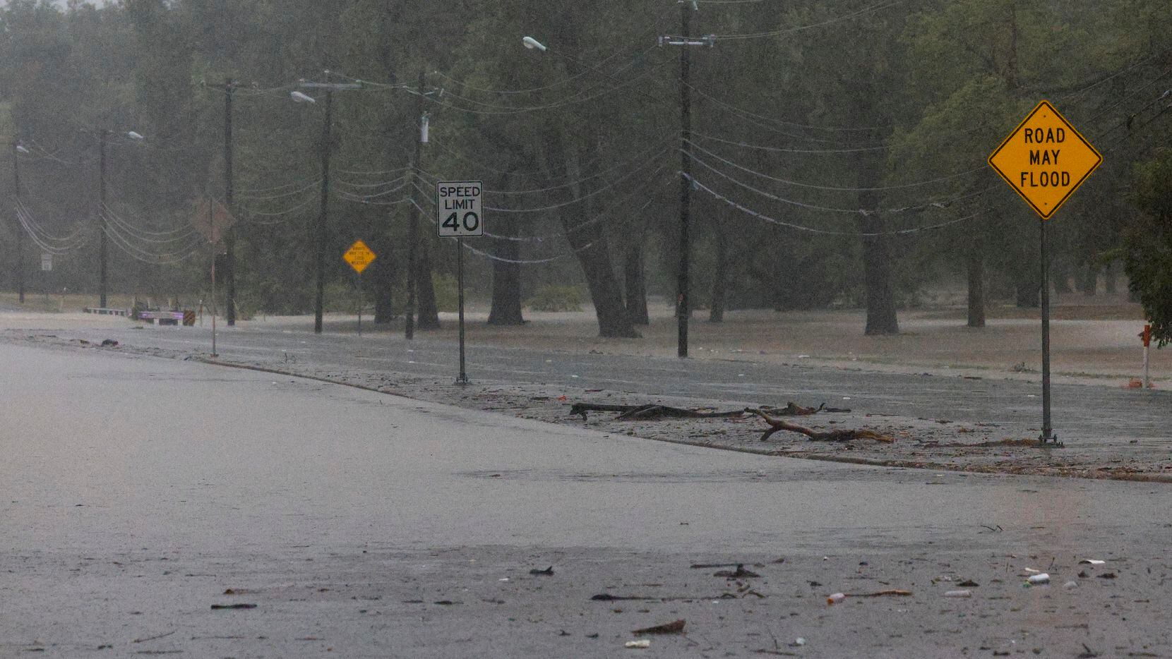 Water floods most of Buckner Boulevard near Lake Highlands Park in Dallas, Monday, Aug. 22,...