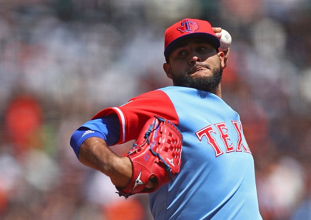 Texas Rangers pitcher Martin Perez works against the San Francisco Giants in the first inning of a baseball game Saturday, Aug. 25, 2018, in San Francisco. (AP Photo/Ben Margot)
