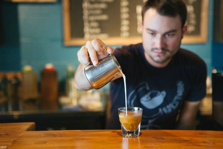 Cultivar co-founder Jonathan Meadows pours a shot of espresso.