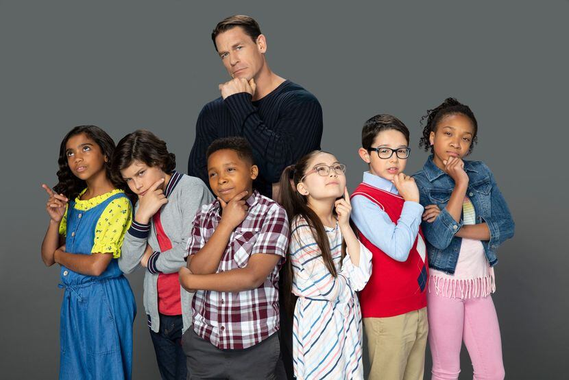 The cast of Are You Smarter Than A 5th Grader with host John Cena. Colin Heintz is second...