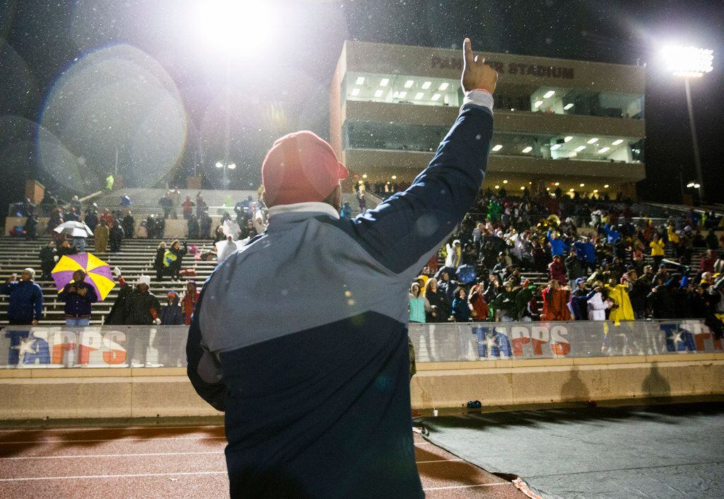 Bishop Dunne head coach Michael Johnson celebrates after winning the TAPPS Division I state...