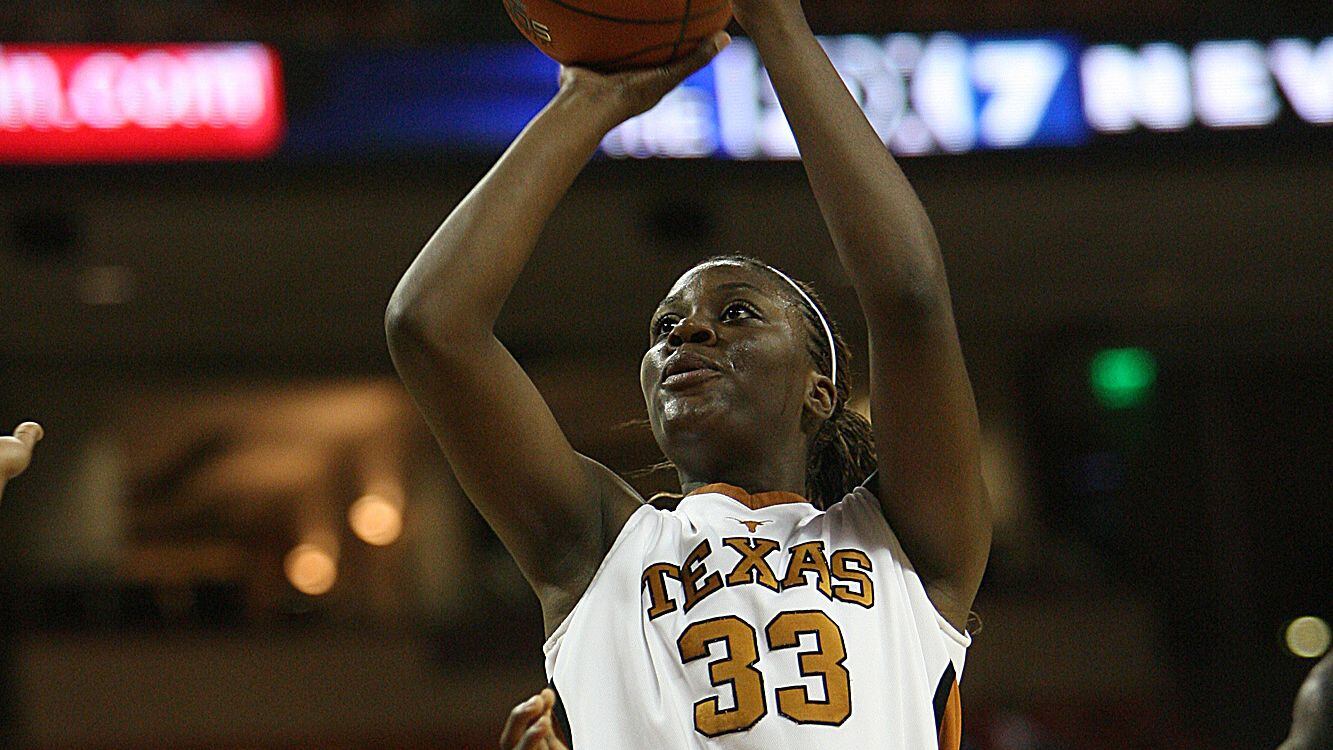 Texas' Tiffany Jackson shoots past Texas A&M-Corpus Christi's Jenesis Shaw, left, during the...