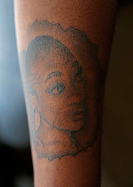 ShaDarrion Jacobs, 20, has a tattoo of his sister NeQuacia Jacobs, who was killed in a...