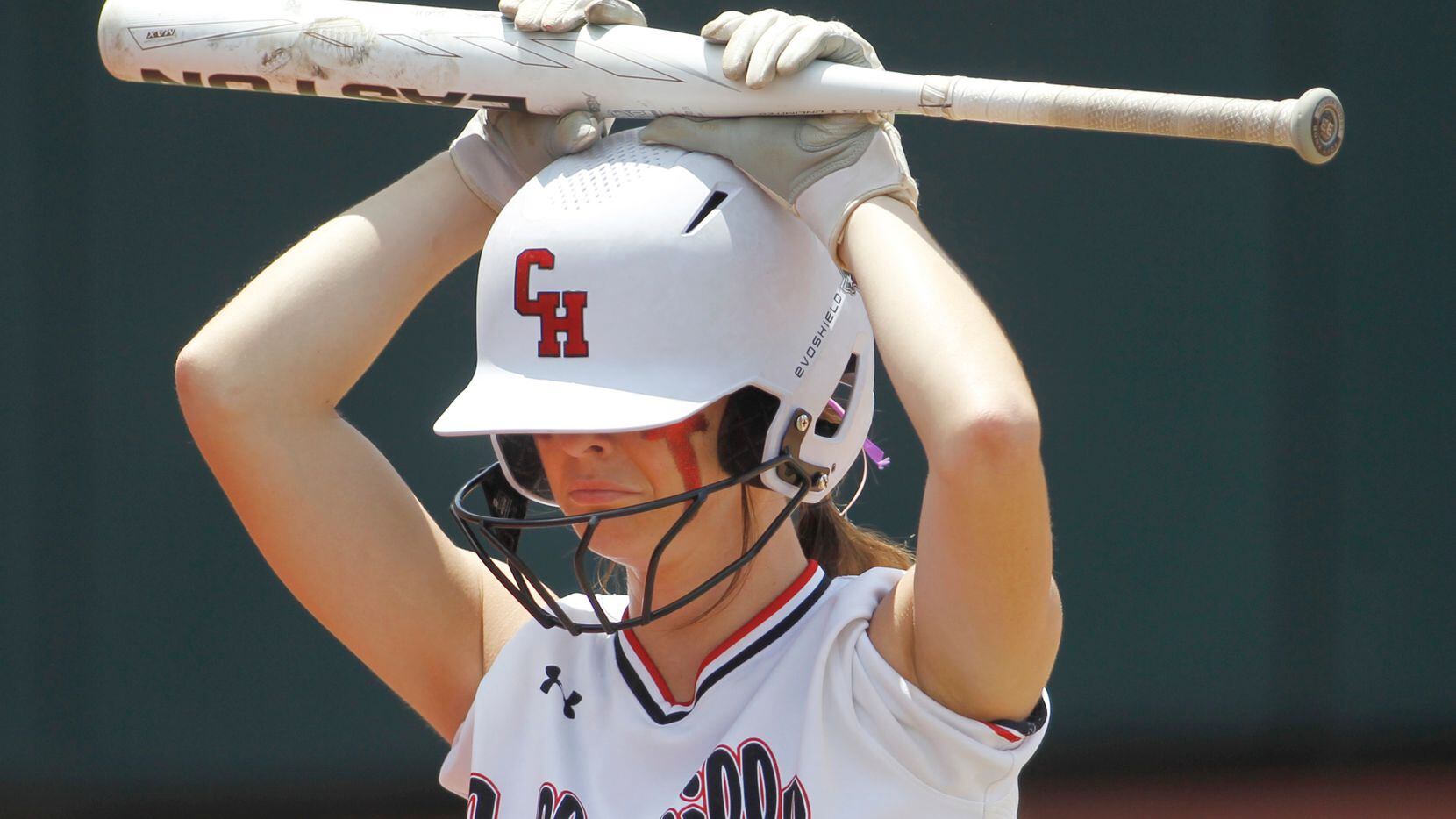 Colleyville Heritage third baseman Graci Green (11) returns to the dugout as the last batter...