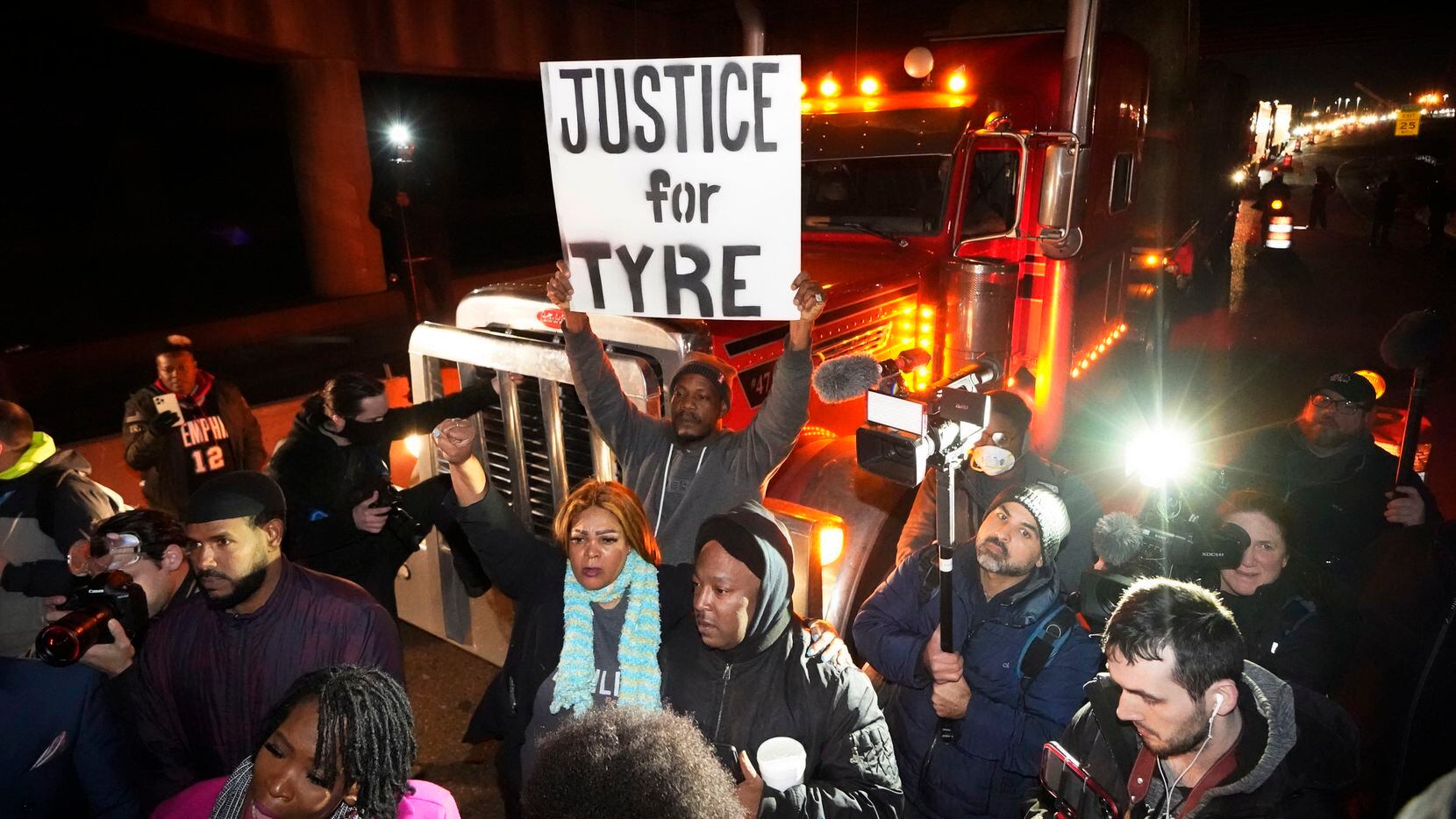 Protesters march down the street Friday, Jan. 27, 2023, in Memphis, Tenn., as authorities...