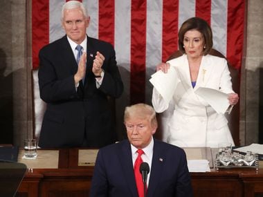 House Speaker Nancy Pelosi rips up pages of the State of the Union address after President Donald Trump finishes delivering it on Feb. 4, 2020, the night before the Senate voted to acquit him in his impeachment trial.
