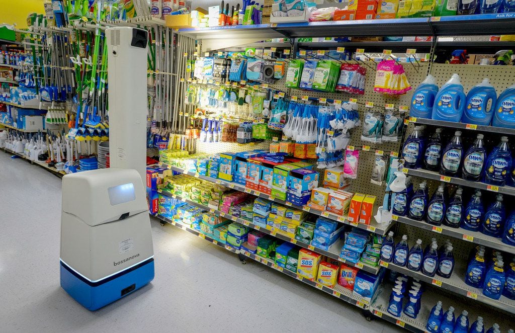 A robotic shelf scanner moves along an aisle at a North Richland Hills Walmart on April 5, 2019.