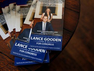 Campaign door hangers sit on a table during a campaign fundraiser for Texas state...