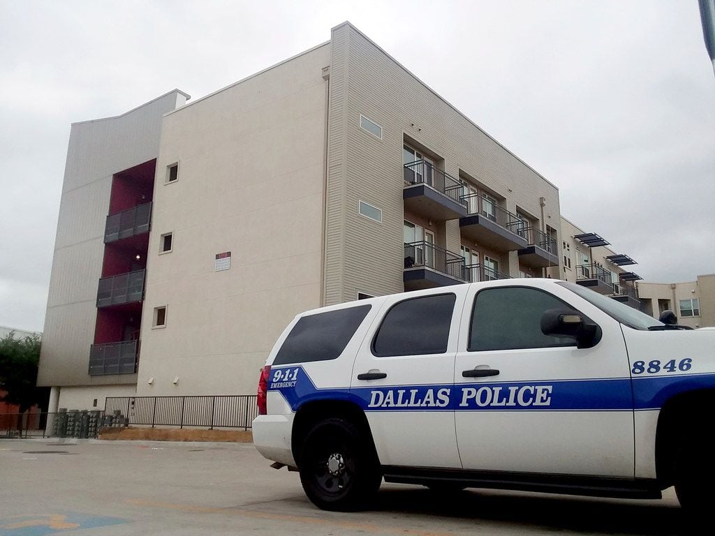 A police vehicle was parked near the South Side Flats apartments on Monday, a few days after...