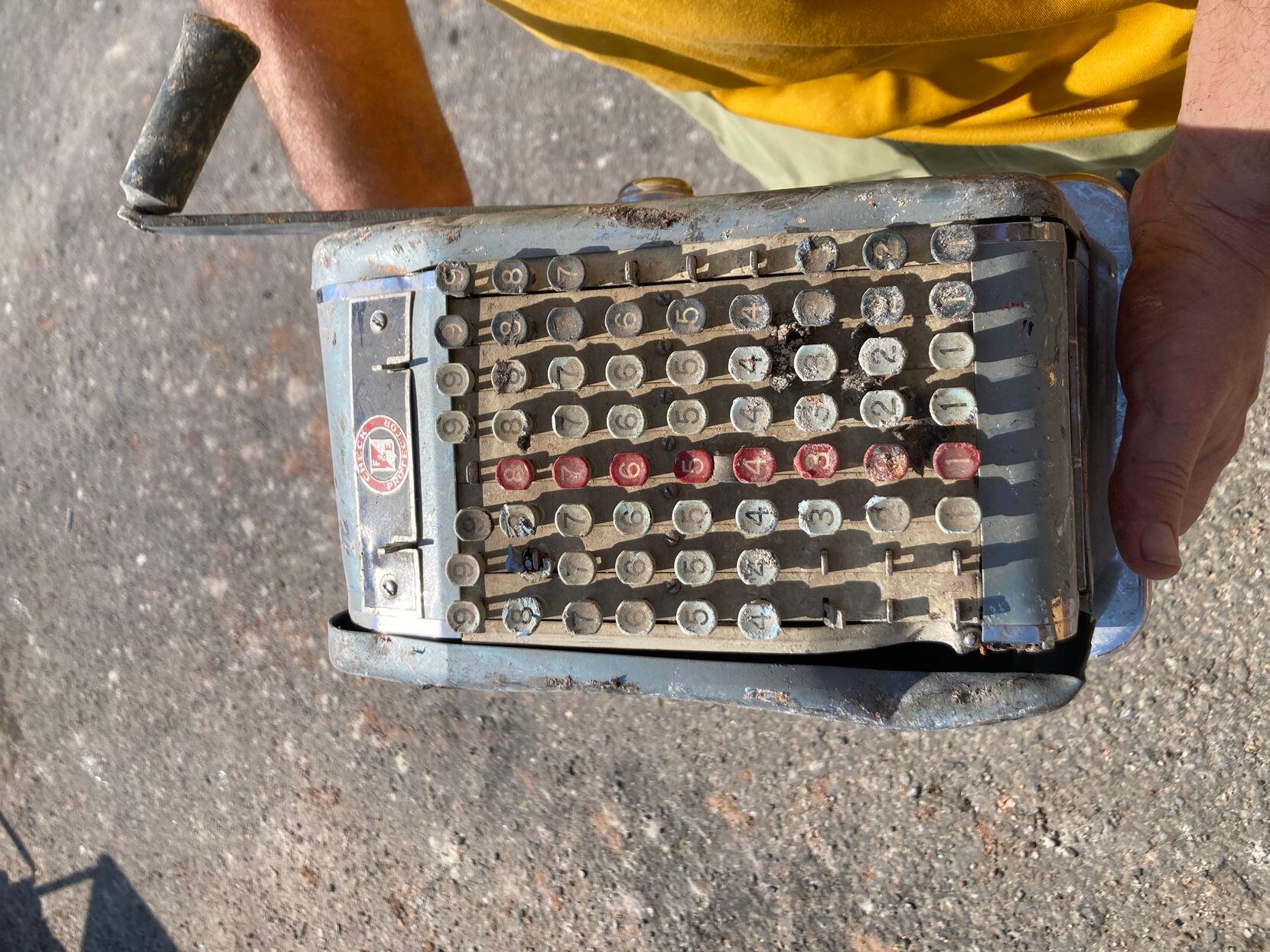 An old manual check machine pulled from the debris after the city of Melissa demolished...