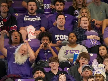 TCU fans react after a first half Horned Frogs interception during a College Football...