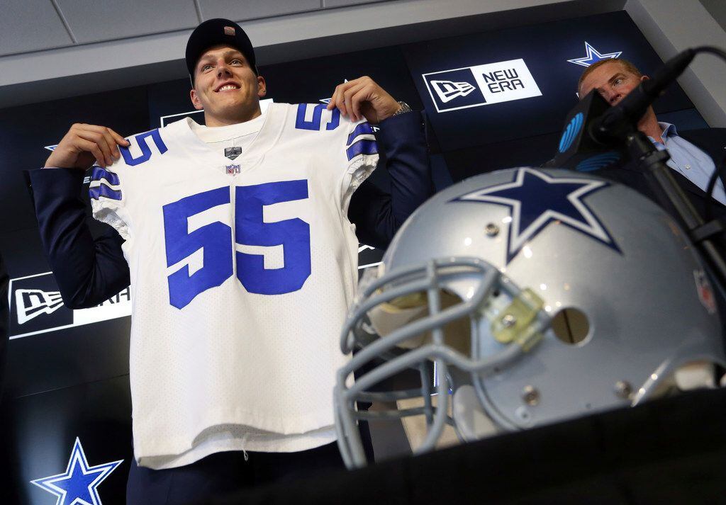 Dallas Cowboys first round draft pick Leighton Vander Esch holds up a jersey at the end of...