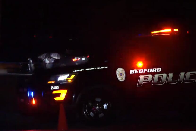 Bedford police at the scene where an officer shot a suspect who fled after a traffic stop...