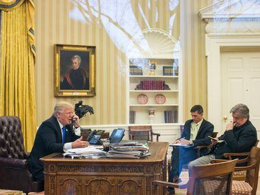 President Trump takes a call Jan. 28, 2017, with National Security Advisor Michael Flynn and...