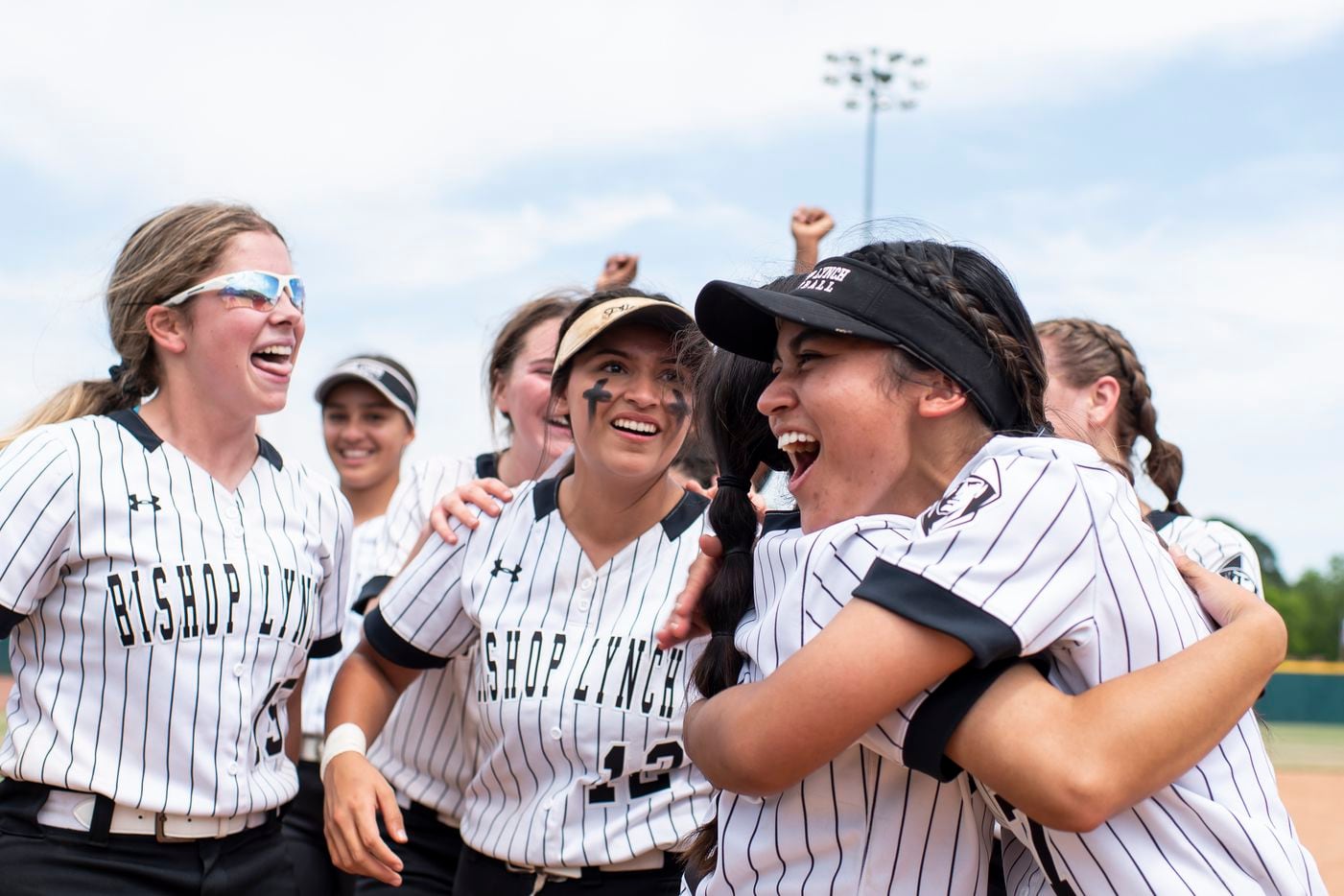 Bishop Lynch players celebrate after winning the TAPPS Softball Division II State Semifinal...