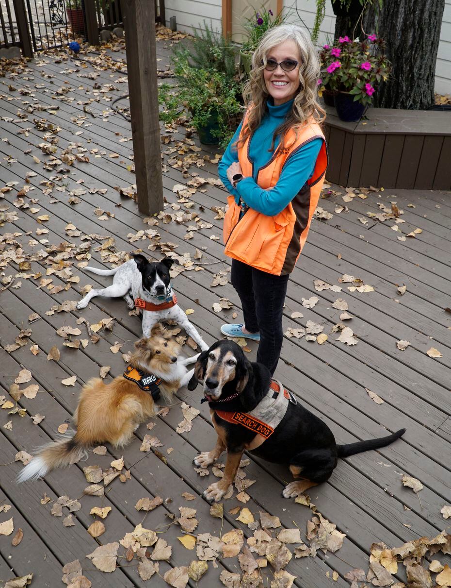 Bonnie McCririe-Hale with her dogs, Idabel, a black and tan coon hound; Buck, a pointer pit bull mix; and Kaio, a Shetland sheep dog, at her home in Grapevine.