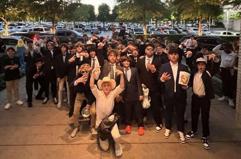 More than 150 high schoolers dressed in suits stormed an AMC theater in NorthPark Center...