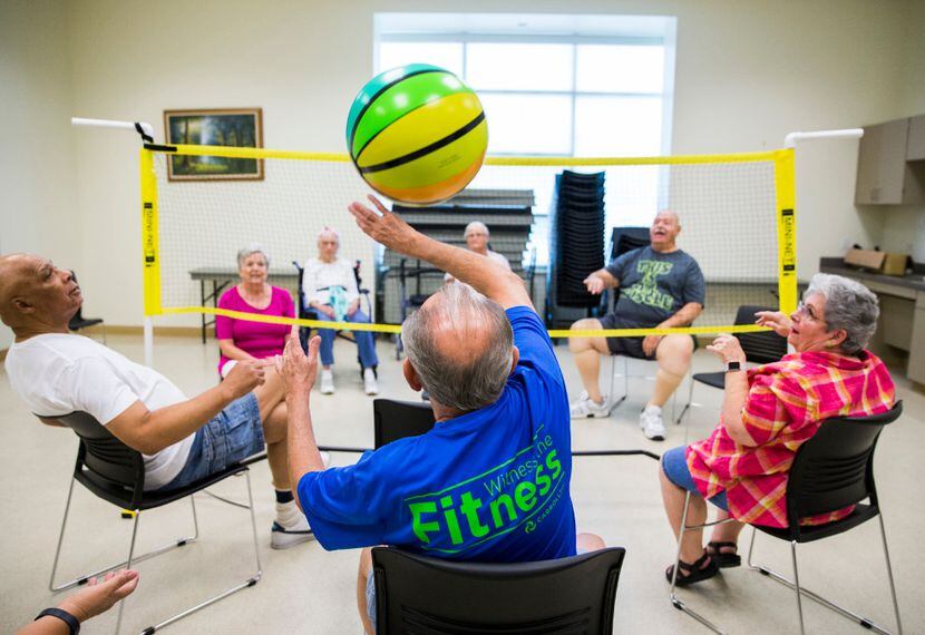 Dan Smith, center, plays chair volleyball with other seniors in September, 2016 at the...