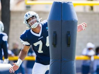 Dallas Cowboys defensive end Jalen Jelks (74) attacks a dummy during a morning practice at training camp in Oxnard, California on Thursday, August 8, 2019.