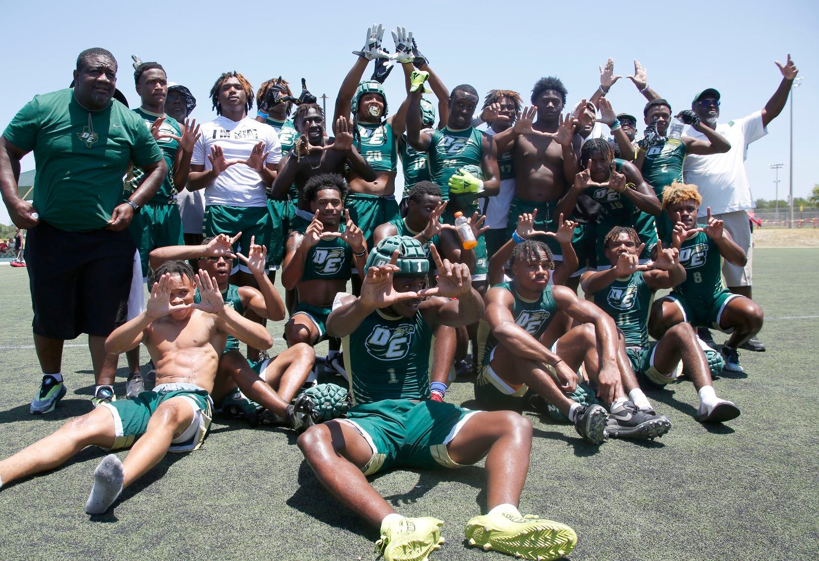 DeSoto Eagles football players pose for a team photo after capturing the Division 1...