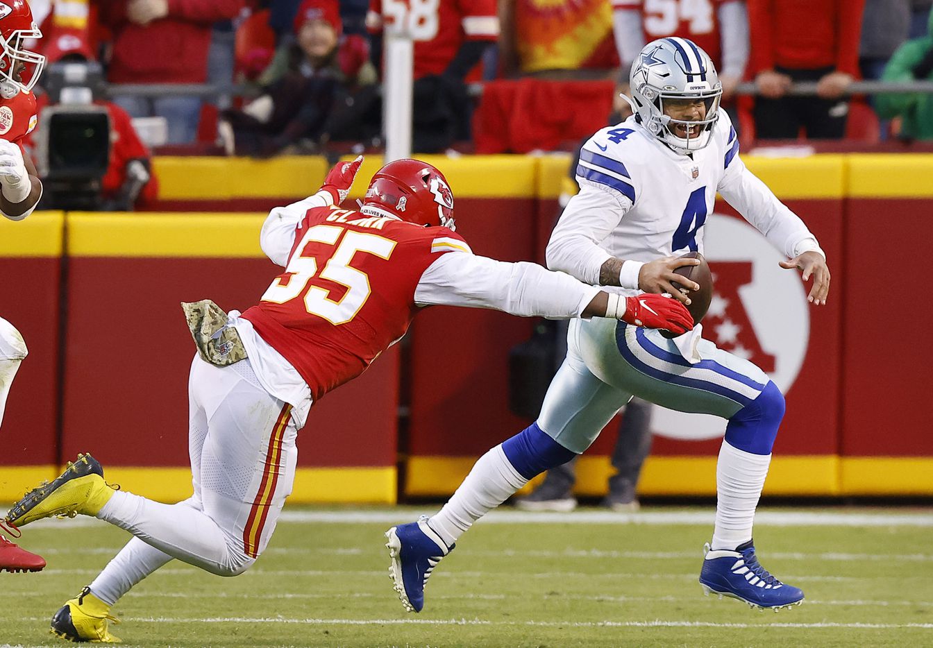 Dallas Cowboys quarterback Dak Prescott (4) is chased by Kansas City Chiefs defensive end...