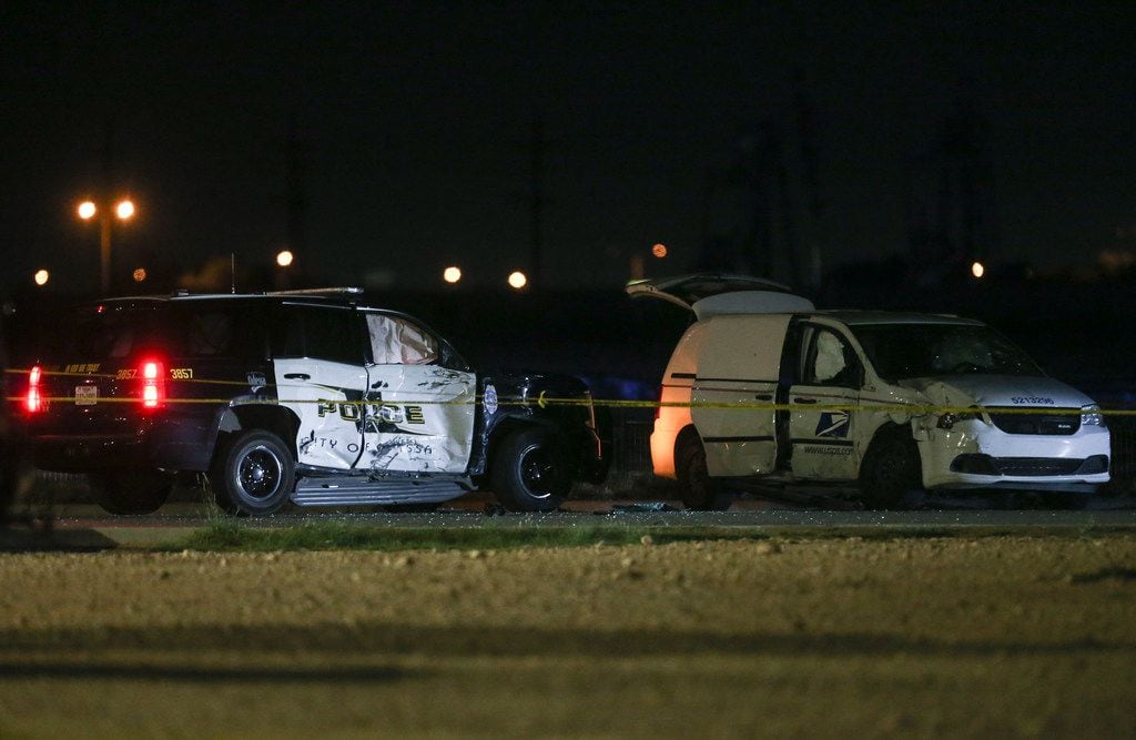 A crashed U.S. Postal Service vehicle and Odessa Police vehicle are seen Saturday, Aug. 31,...