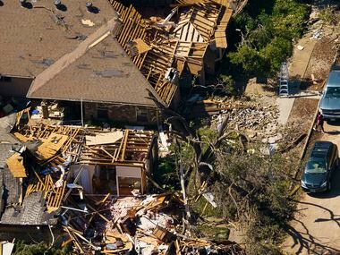 Damaged homes along Tall Oaks Drive on Monday, Oct. 21, 2019, in Richardson.