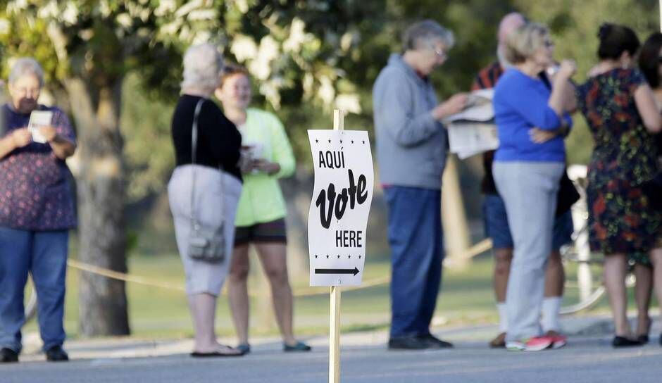 Voters waited in line to show their IDs and vote in San Antonio last fall.