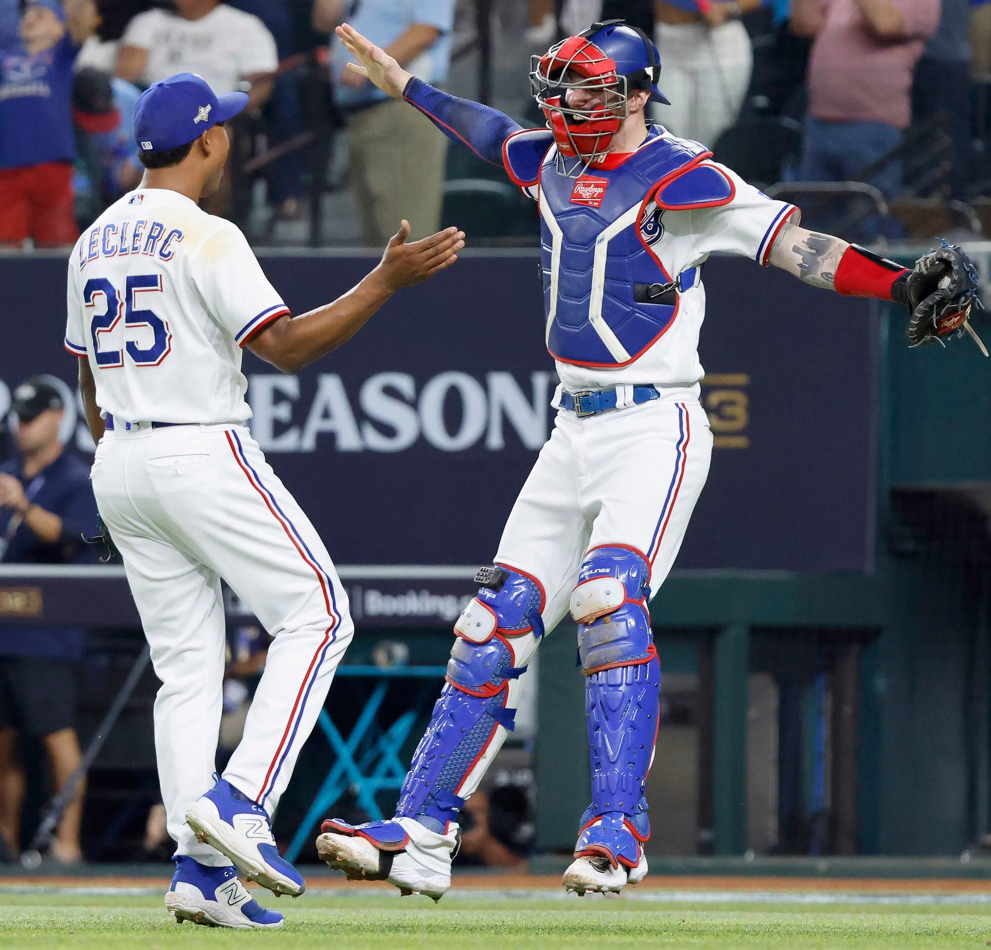 Texas Rangers relief pitcher Jose Leclerc is congratulated by catcher Jonah  Heim after the Rangers