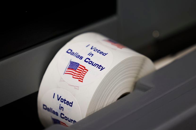 A roll of “I Voted in Dallas County” stickers at DS-200 vote tabulator at Dallas county...