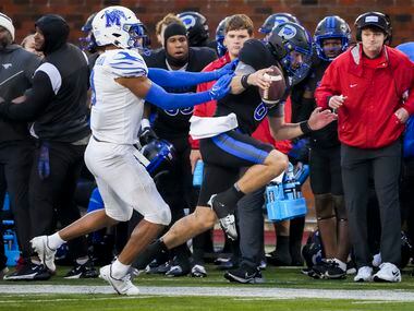 SMU quarterback Tanner Mordecai (8) is pushed out of bounds by Memphis linebacker Geoffrey...