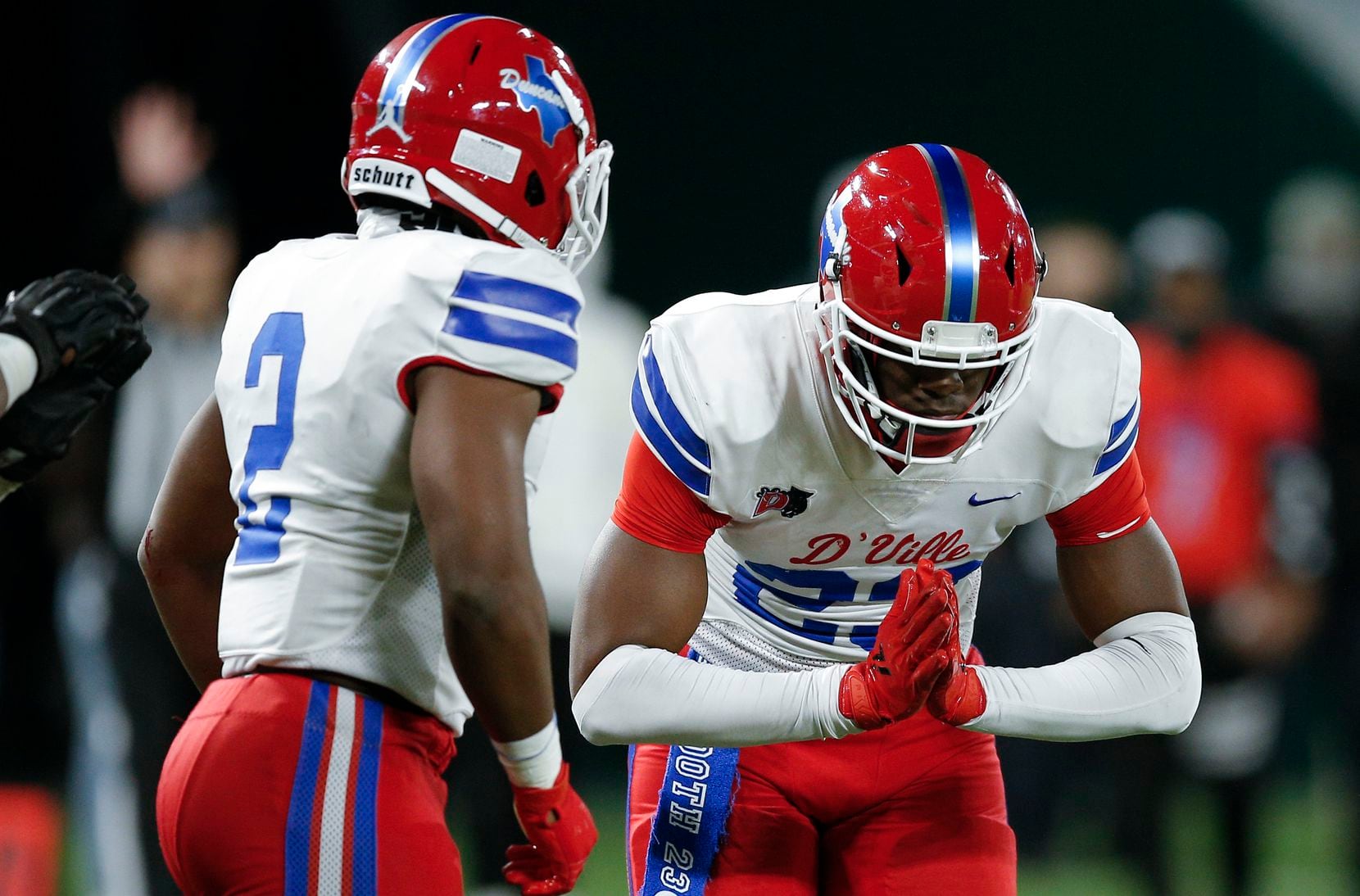 Duncanville junior linebacker Jordan Crook (2) looks on as junior defensive end Omari Abor (23) celebrates a sack during the first half of a Class 6A Division I Region II final high school football game against DeSoto, Saturday, January 2, 2021.